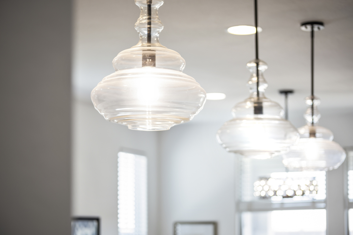 A luxury interior featuring dramatic chandeliers and upscale finishes.