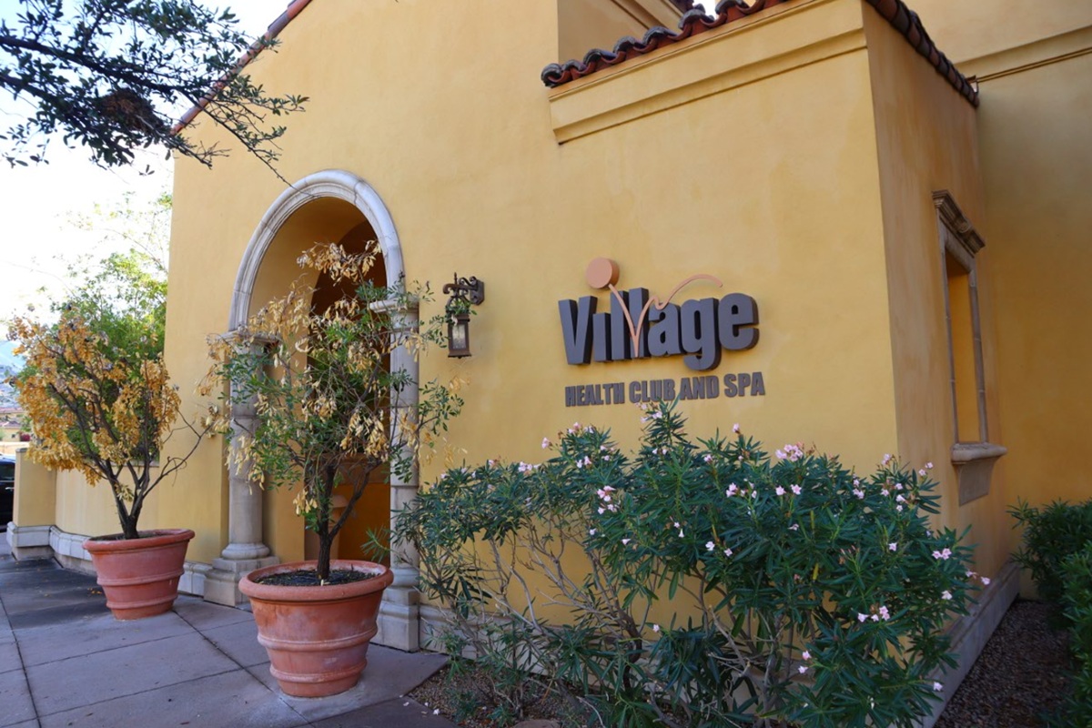 Exterior of Village Health Club & Spa in North Scottsdale, featuring Southwestern architecture and landscaped entrance.
