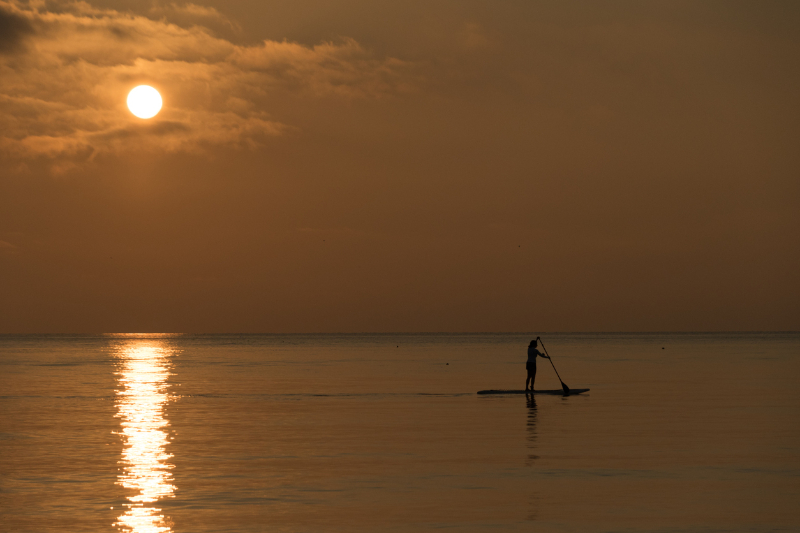Stand up paddle board woman paddleboarding at Madeira Beach