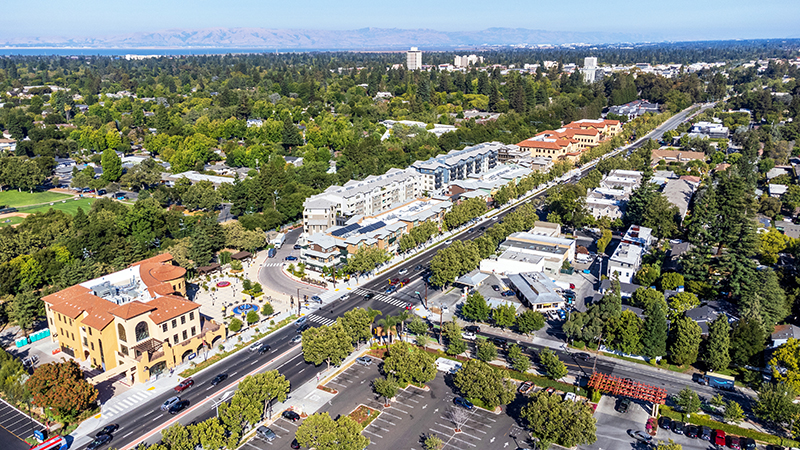 Aerial view of commercial and residential areas of Menlo Park, California toward Palo Alto along El Camino Real Rod near Middle Avenue.