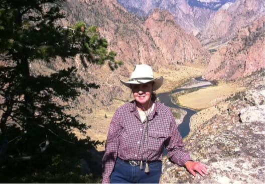 Woman overlooking a river canyon in Wyoming