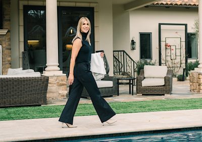 Silicon Valley REALTOR, Julie Wyss, strolling alongside a swimming pool.