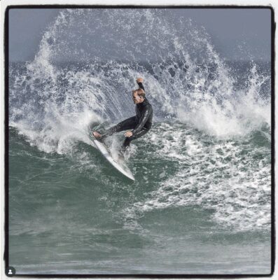 Andy Lyon surfing in Malibu, showcasing his lifelong connection to the Malibu coastline and coastal lifestyle.