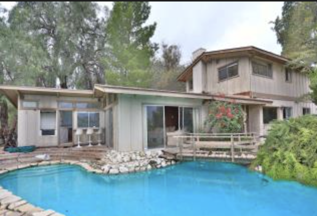 Two-story Woodland Hills, CA home with pool and patio, represented by 4 Malibu Real Estate