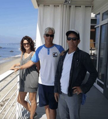 4 Malibu Real Estate team standing on a Malibu beachfront deck, representing trusted local real estate experts.