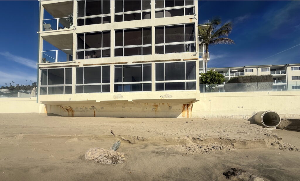 Deferred exterior paint and stucco maintenance on a Malibu beachfront home showing rust staining and weather exposure