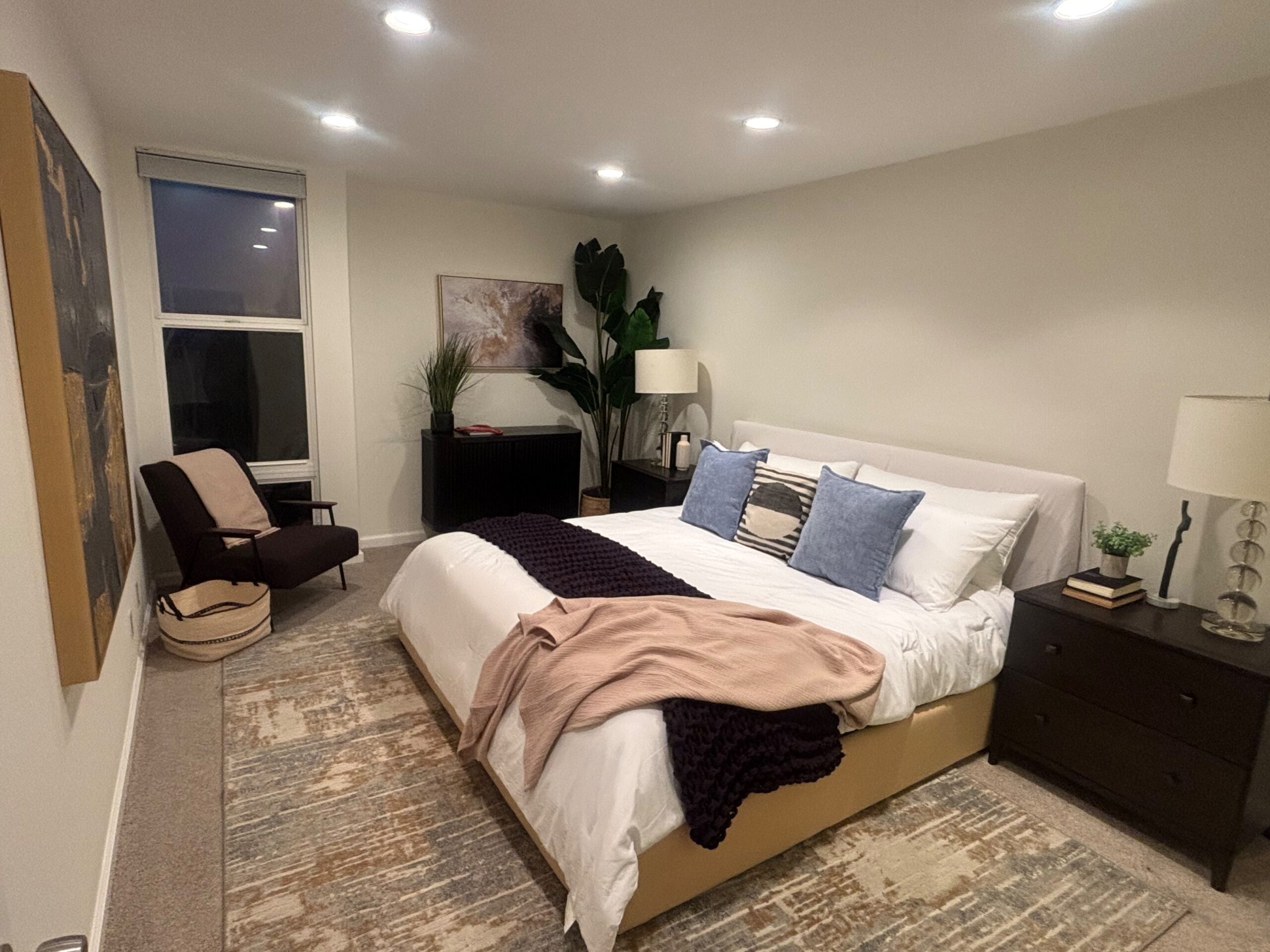 Furnished bedroom with blue accent pillows at 23901 Civic Center Way number 235