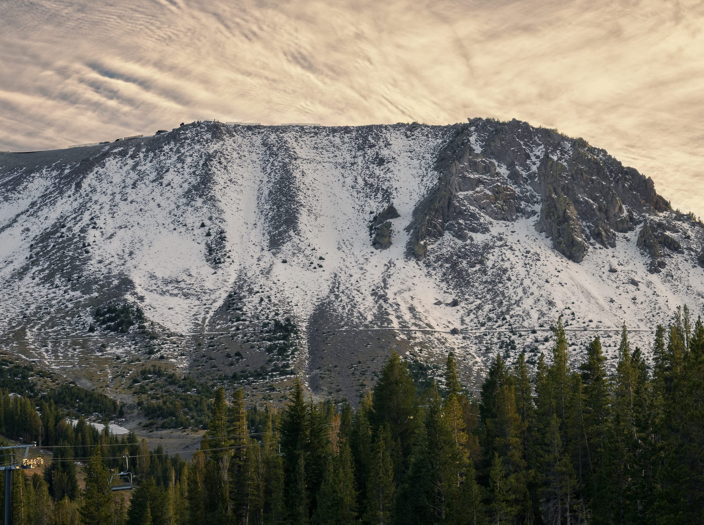 Snow-covered mountain slopes and pine trees in Mammoth