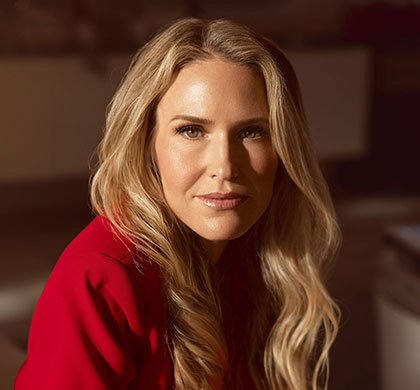 Summer Goralik in a red suit