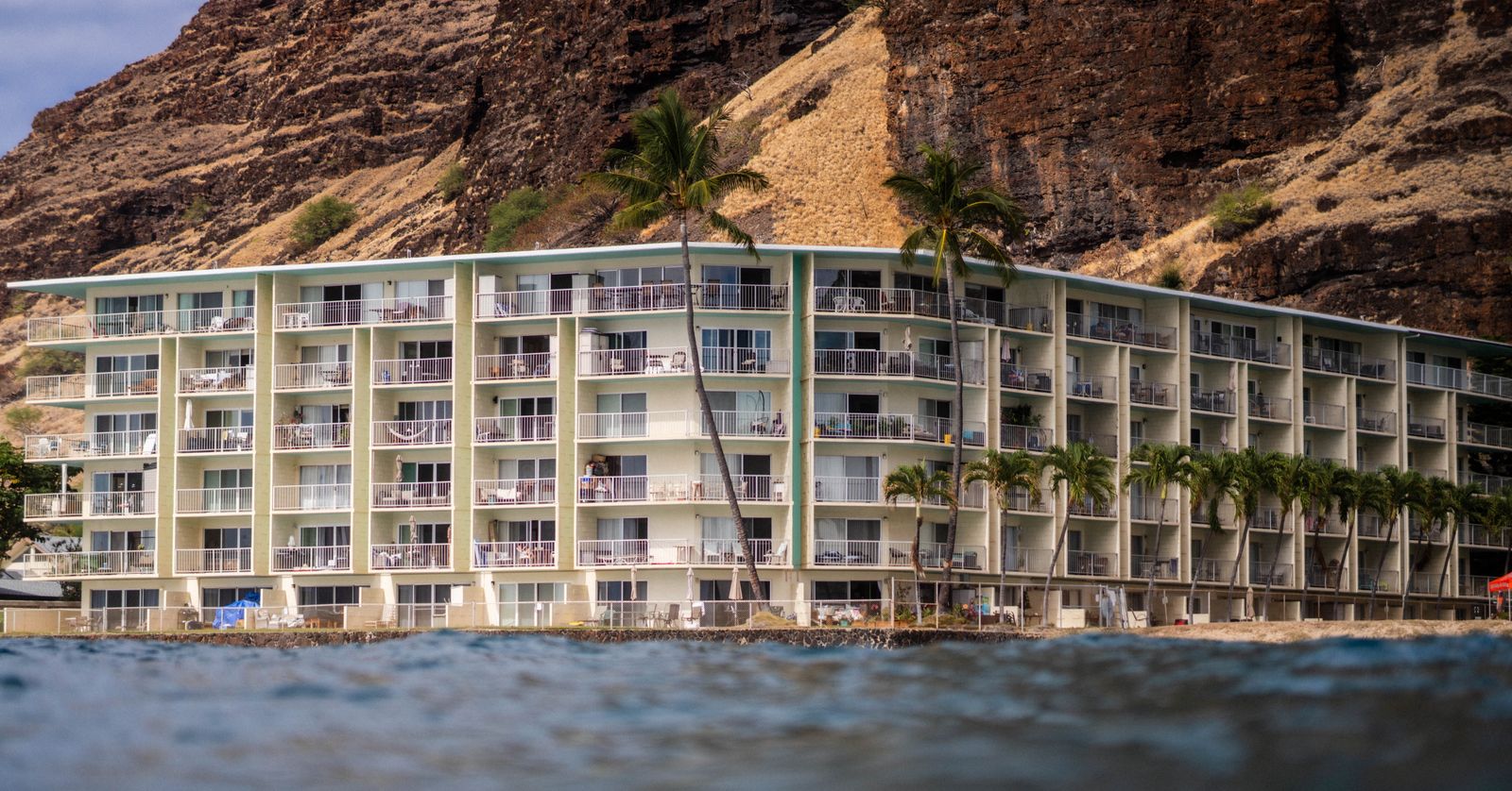 Luxury oceanfront home below a Maui cliff