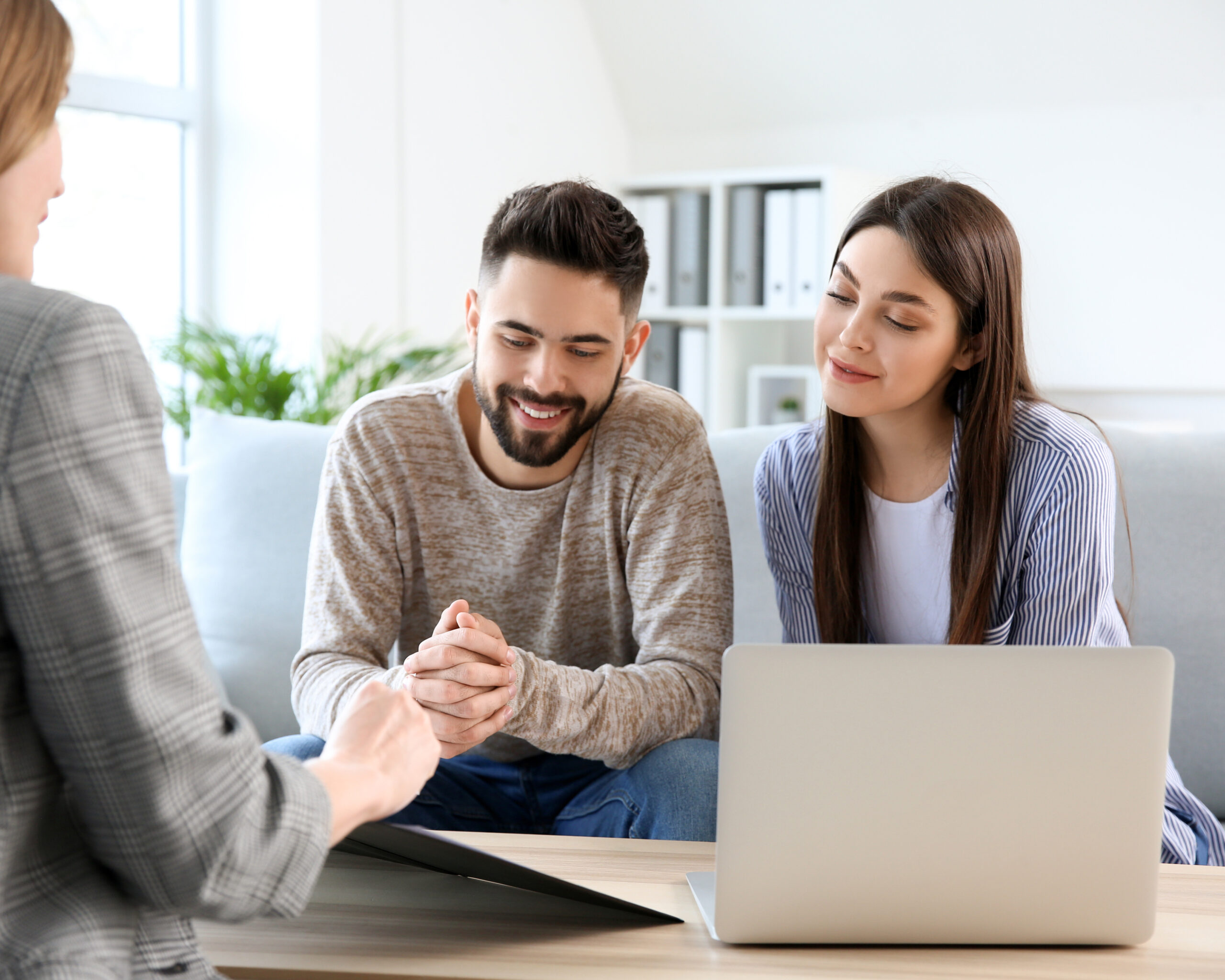 Young couple in office of real estate agent