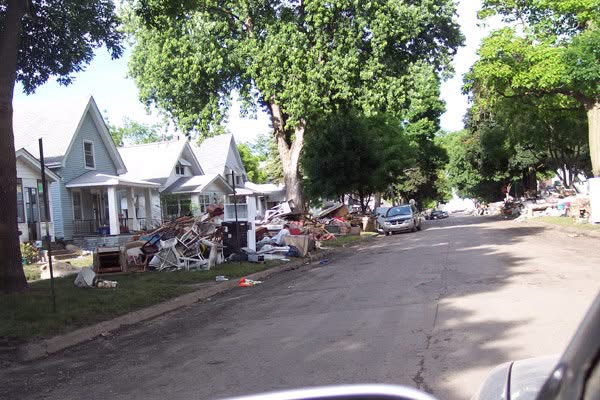 A Cedar Rapids street lined with debris after the 2008 flood.