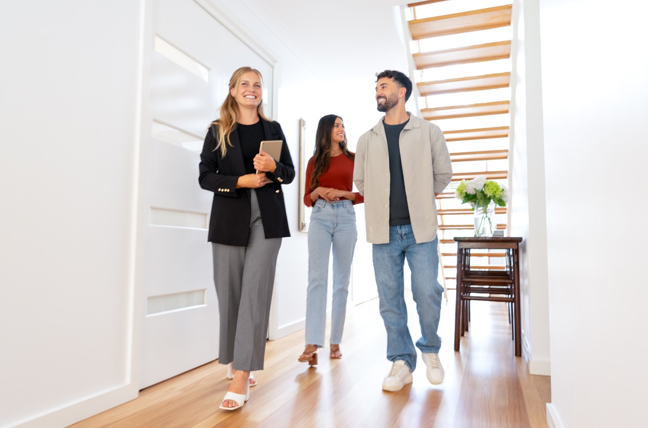 couple house touring with agent