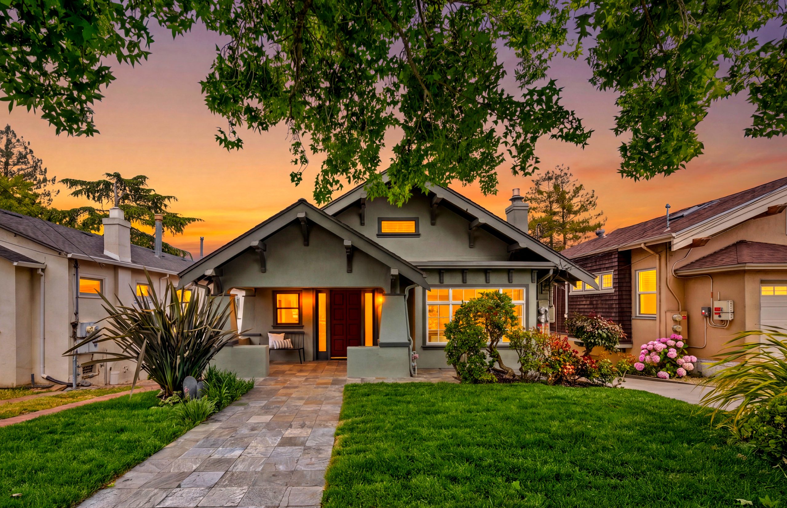 Craftsman bungalow with a deep front porch on a tree-lined street in Glenview, Oakland