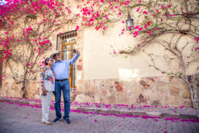 An old couple taking a photo