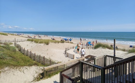 Scenic view of Onslow Beach with dunes and ocean waves
