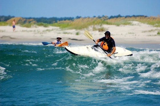 Person kayaking in calm waters at Hammocks Beach State Park