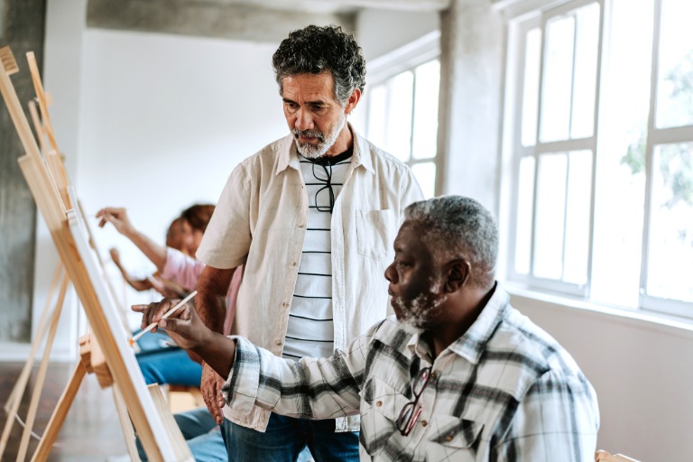 Art studio teacher teaches senior students