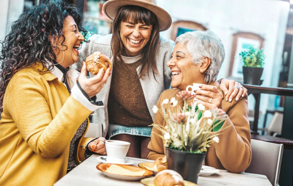 Three senior women enjoying breakfast