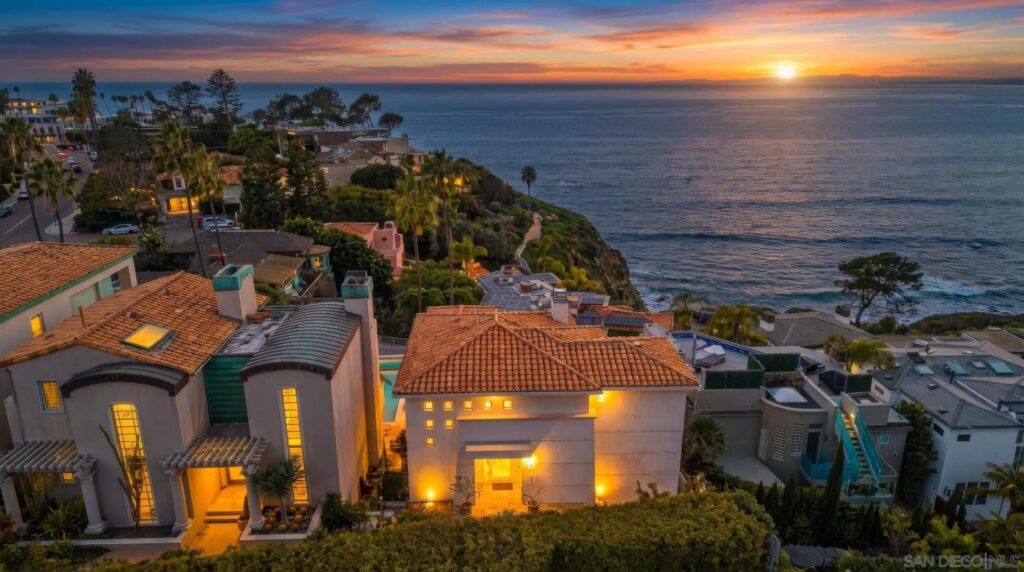From the western slopes, Mount Soledad views pair Pacific sunsets with close-in ocean sightlines and hillside homes above the water.