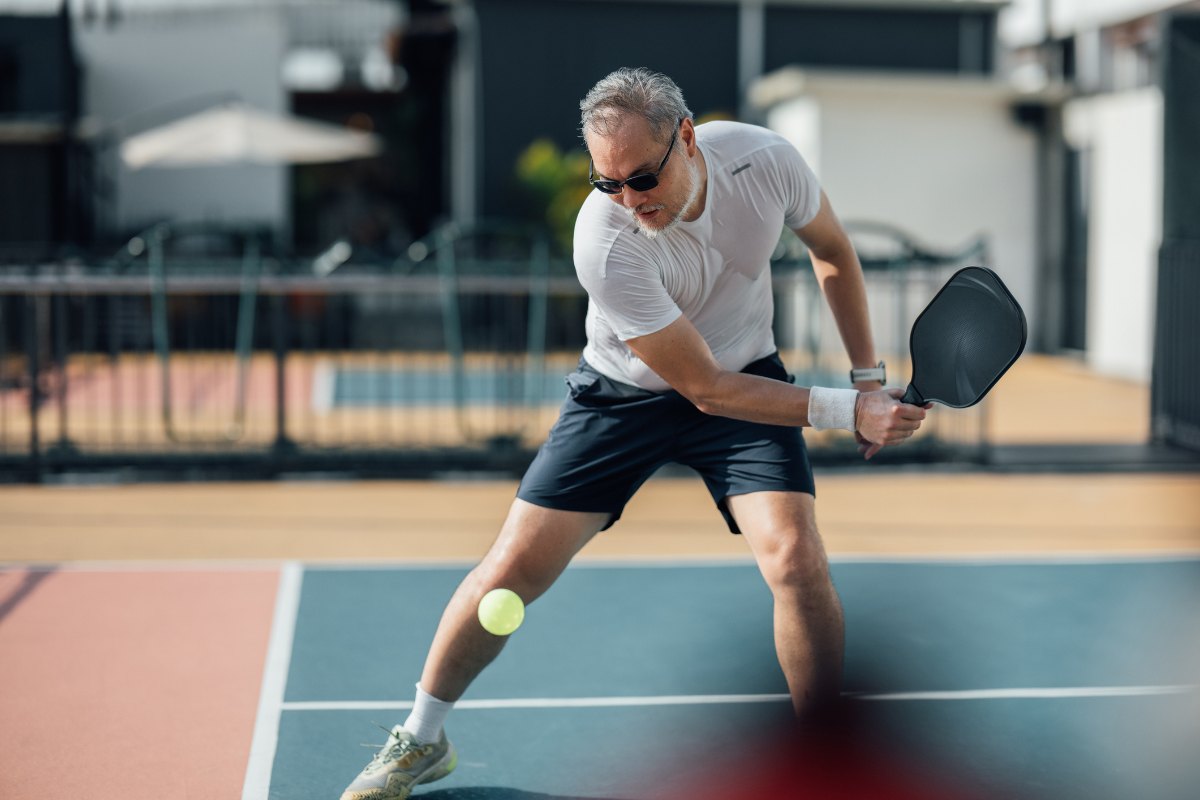 Mastering the Backhand: A Mature Athlete in the Heat of Outdoor Pickleball