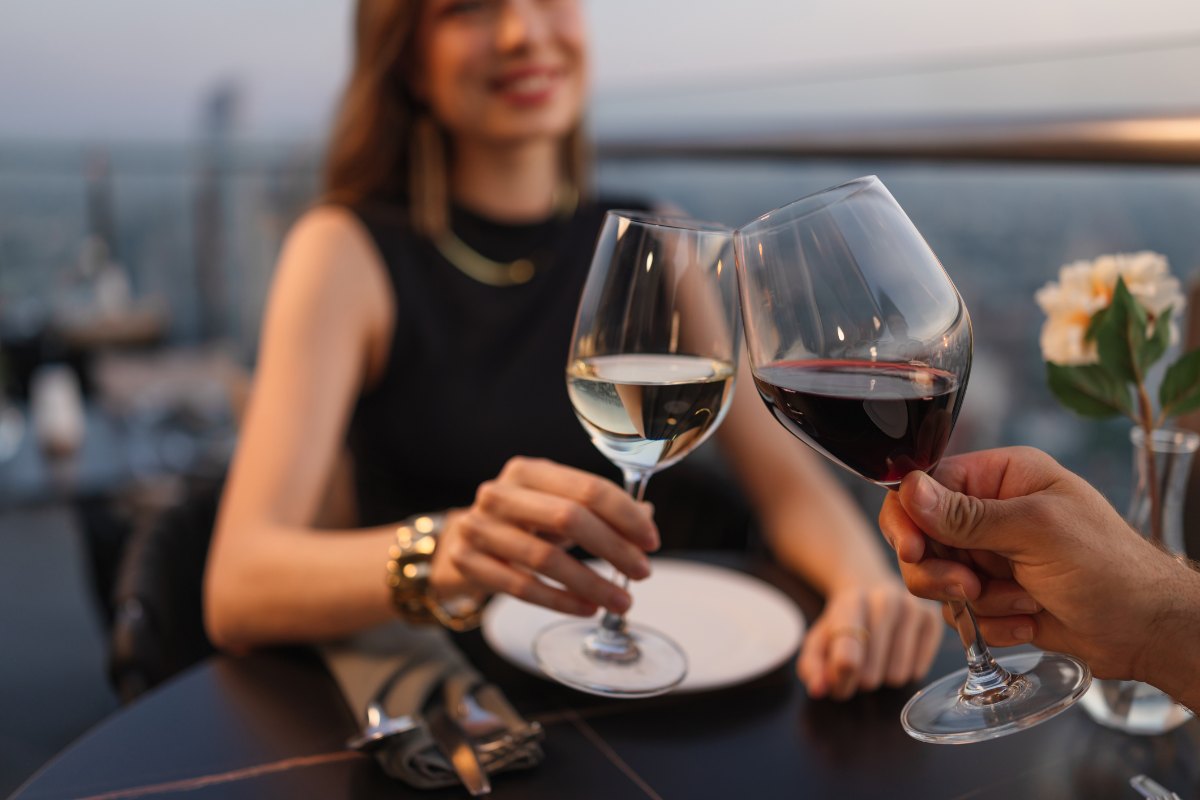 Couple toasting with wine glasses